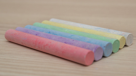 Colored chalk and white chalk in a row