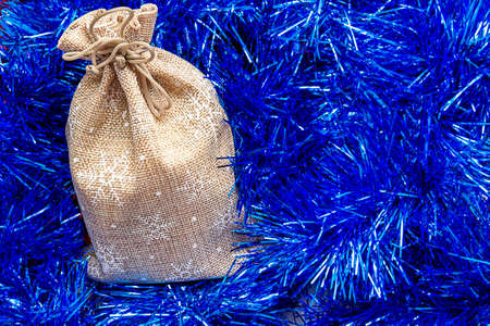 Natural packaging of a tranny bag on a background of tinselの写真素材