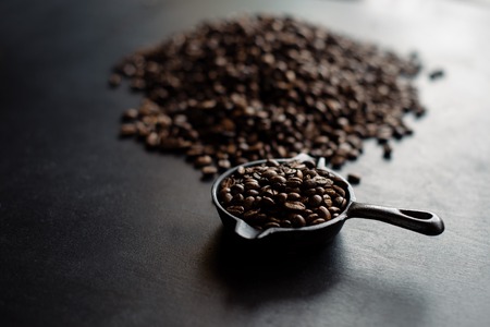 Coffee roasting fresh. pan on a black background