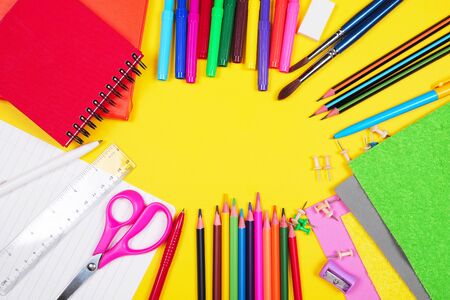 Different colorful School supplies on yellow background. Back to school sale, sopping concept. Copy space.の写真素材