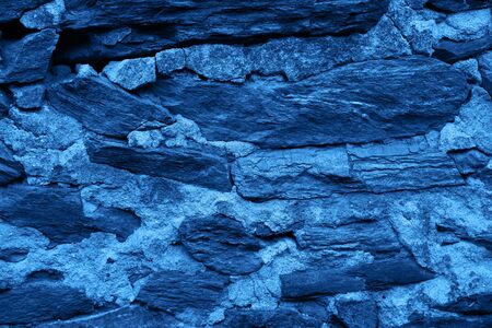 Classic blue color concrete wall stone brick texture background. Concept color of the year 2020の写真素材