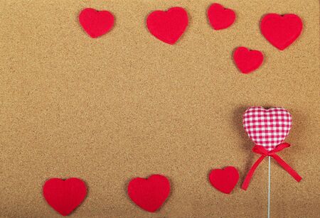 Greeting Card for Valentine's Day. Red hearts on wooden background. Copy space. Flat lay. Top view.の写真素材