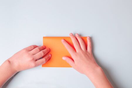 Step by step photo instruction. How to make origami paper boat. DIY for children. Childrens art project craft for kidsの写真素材