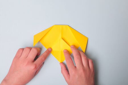 Step by step photo instruction. How to make origami paper dog. DIY for children. Childrens art project craft for kidsの写真素材