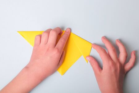 Step by step photo instruction. How to make origami paper puppy dog. DIY for children. Children's art project craft for kids. の写真素材