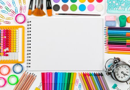 Back to school shopping concept. School supplies with blank sheet of paper on white background. Flat lay, copy space.の写真素材