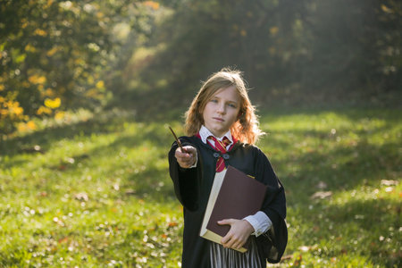Witch girl with magic wand cosplay wizzard outdoor. Halloween holiday. Halloween costume.