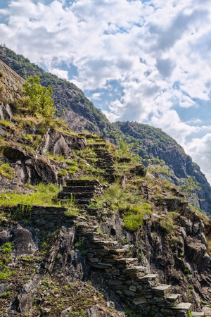 Fort Bard, Valle d'Aosta, Italy - August 18, 2017: Historic military construction defence Fort Bard. Touristic medieval fortress in Italian Alps. Location of the Avengers: Age of Ultron film.のeditorial素材