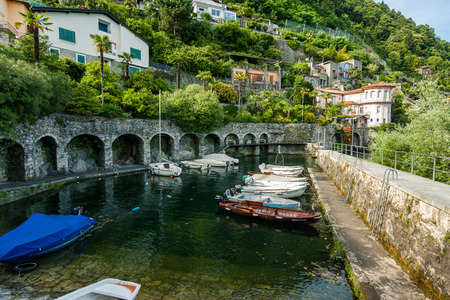 Small old port with boats on the lake, Cannero Riviera, Lago Maggioreのeditorial素材