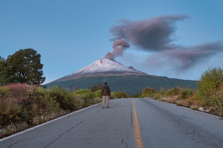 Young man on the road to Popocatepetl volcanoの写真素材
