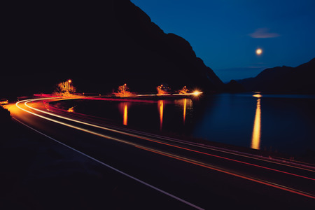 Night road, mountain and Lakeの写真素材
