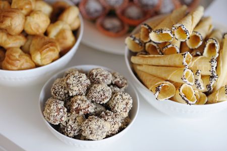 Dishes with delicious cakes on the tableの写真素材