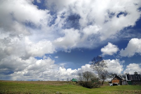 Early spring countryside landscape with beautiful cloudsの写真素材