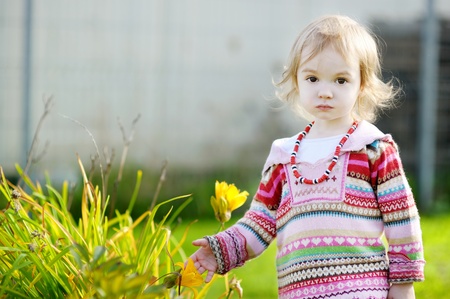 Adorable toddler girl outdoors on beautiful autumn dayの写真素材