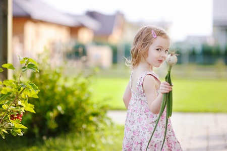 Adorable little girl helping in a gardenの写真素材