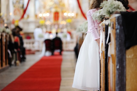 Girl in a white dress watching wedding ceremonyの写真素材