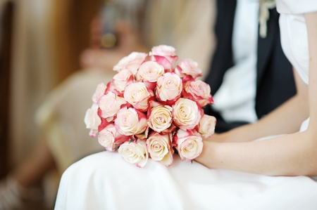 Bride holding flowers during the wedding ceremony