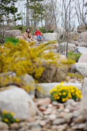 Father and daughter taking a walk in a spring parkの写真素材