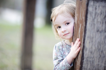 Adorable happy toddler girl smiling outdoorsの写真素材