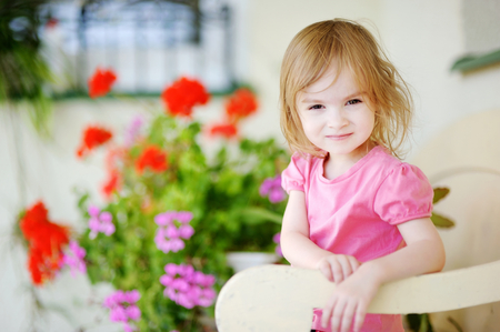Adorable little girl casual portrait outdoorsの写真素材