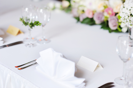 Empty place card on table set for a partyの写真素材