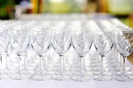 A lot of wine glasses in a rowの写真素材