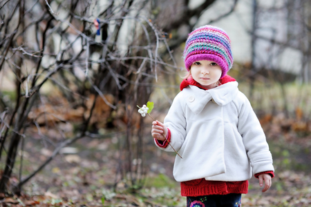 Adorable toddler having fun on beautiful autumn dayの写真素材