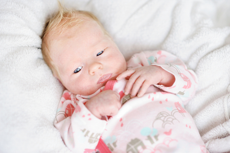 Adorable newborn baby girl portraitの写真素材