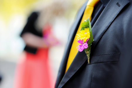 Wedding boutonniere on suit jacket of groomの写真素材