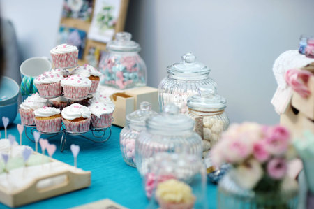 Delicious colorful wedding cupcakes with hearts icingの写真素材