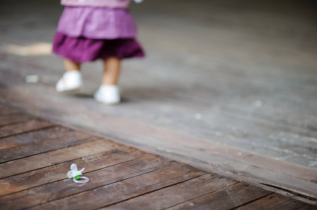 Little baby girl lost her pacifierの写真素材