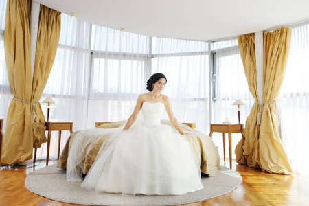 Beautiful bride in luxury hotel roomの写真素材
