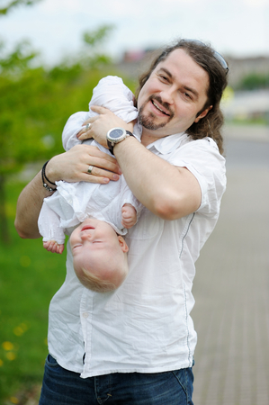 Young father and his little daughter at summerの写真素材