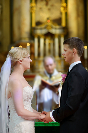 Bride and groom at the church during a wedding ceremonyの写真素材