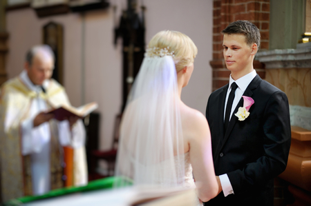 Bride and groom at the church during a wedding ceremonyの写真素材