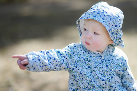 Adorable toddler girl portrait outdoorsの写真素材