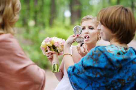 Beautiful bride getting ready for a wedding ceremonyの写真素材