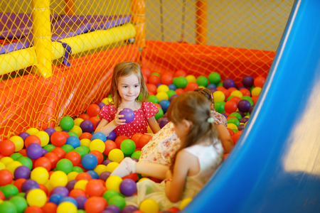 Little toddler girl having fun at the playgroundの写真素材