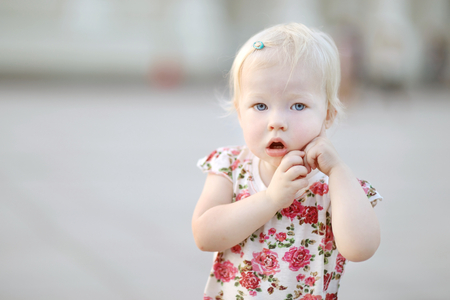 Adorable little girl portrait outdoorsの写真素材