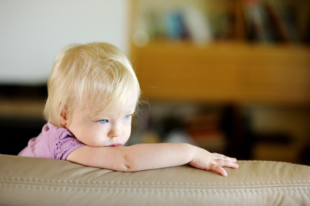 Adorable toddler girl portrait at homeの写真素材