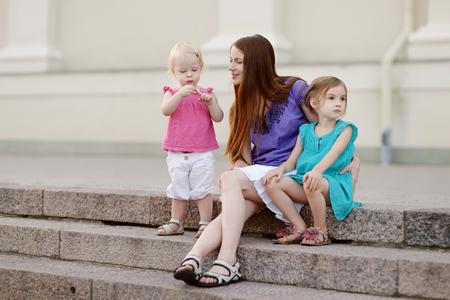Beautiful young family having fun outdoorsの写真素材