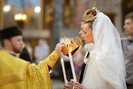 Bride and groom during an orthodox weddingの写真素材