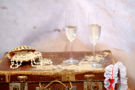 Wedding on a beach: two champagne glasses and pearlsの写真素材