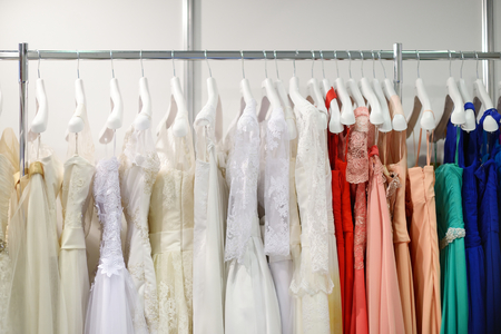 A few beautiful wedding dresses on a hangerの写真素材