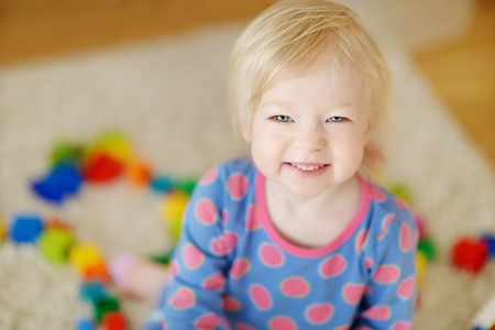 Adorable little girl portrait at homeの写真素材