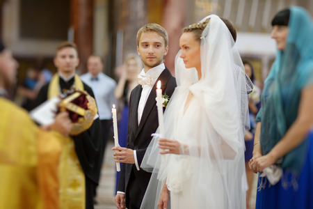 Bride and groom during an orthodox wedding ceremonyの写真素材