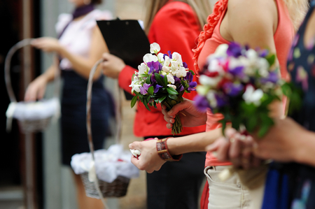 Hands of a woman full of rose petals ready to throwの写真素材