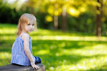 Adorable little girl playing outdoorsの写真素材