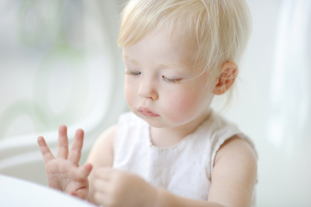 Adorable toddler girl portrait at summerの写真素材