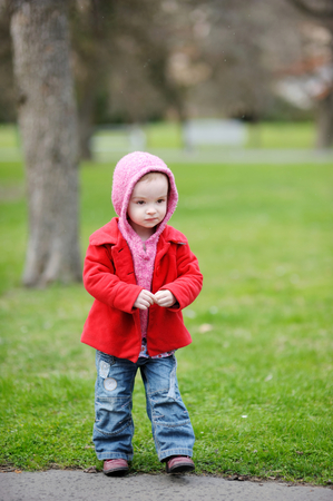 Adorable toddler having fun on beautiful autumn dayの写真素材